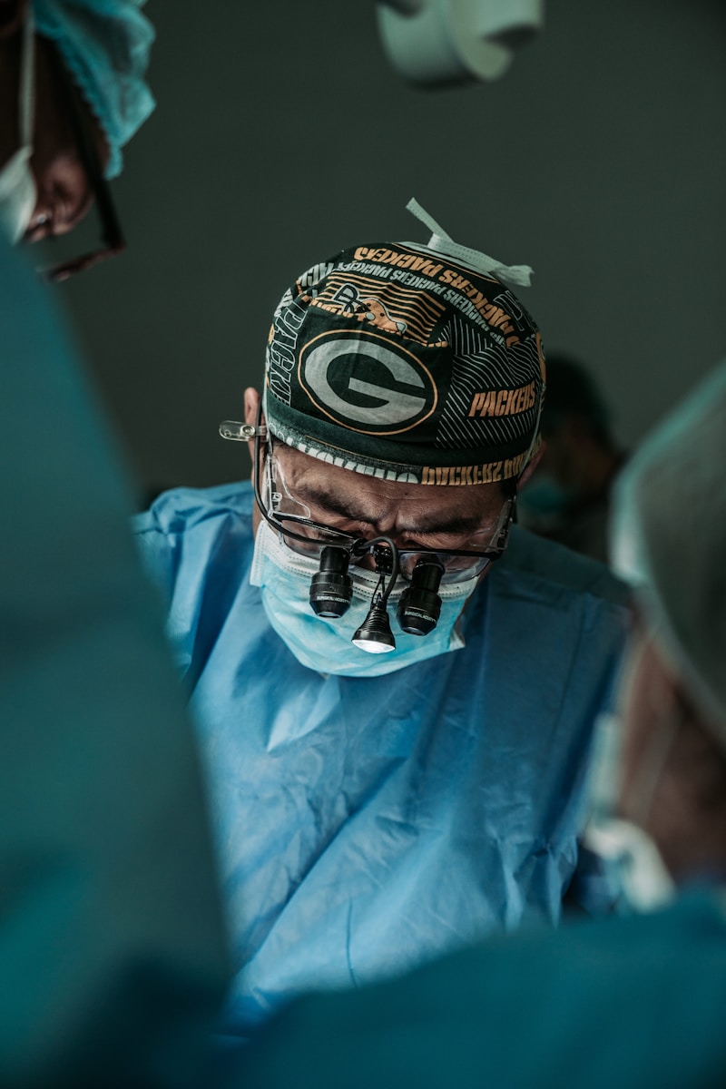 Photo by JC Gellidon doctor wearing Green Bay Packers hat